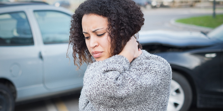 photograph of a woman with whiplash following a car accident