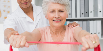 photograph of a an older woman getting OHIP funded physiotherapy