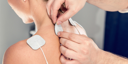 picture of professional performing electrical stimulation