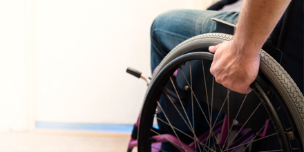 photograph of a person in a wheelchair following a spinal cord injury